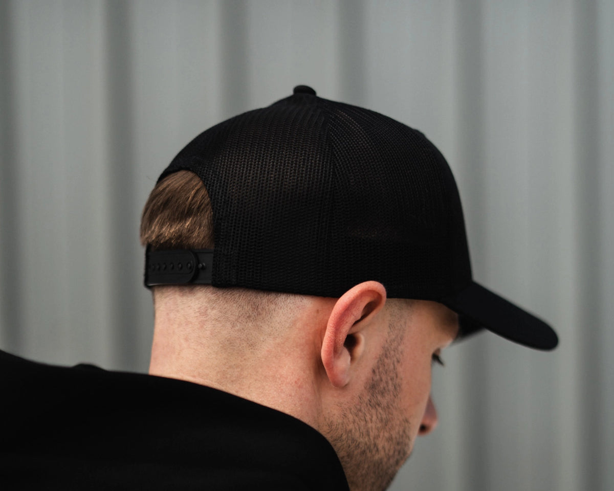 09D Black Performance Trucker Cap