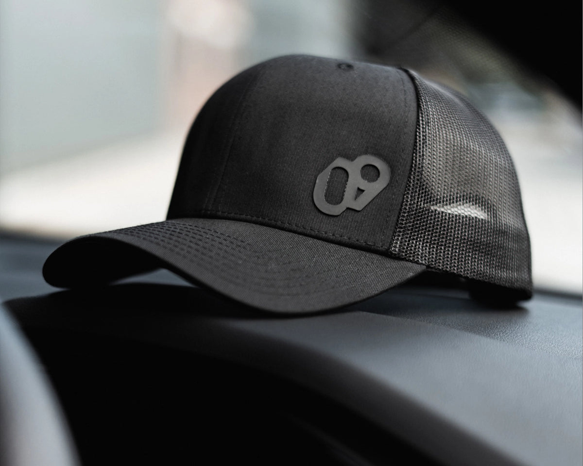 09D Black Performance Trucker Cap